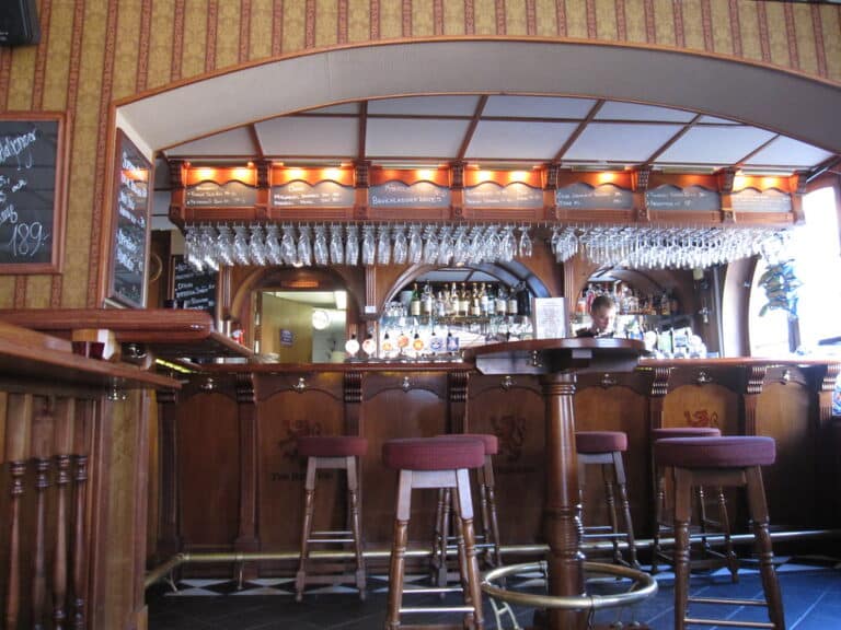 Warm cozy restaurant interior with wood panelling and intimate dining atmosphere